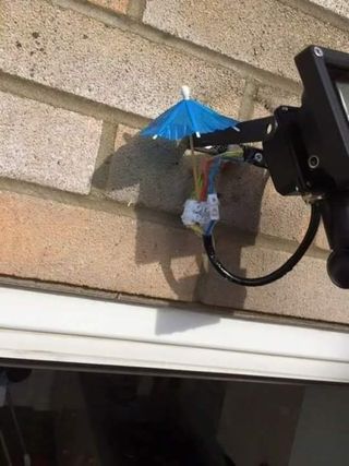 Electric wiring outdoors, covered with a little paper umbrella