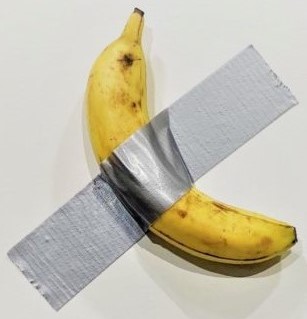 A banana taped to a wall, also known as the artwork "Comedian".