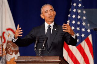 President Obama speaking from behind a pedestal