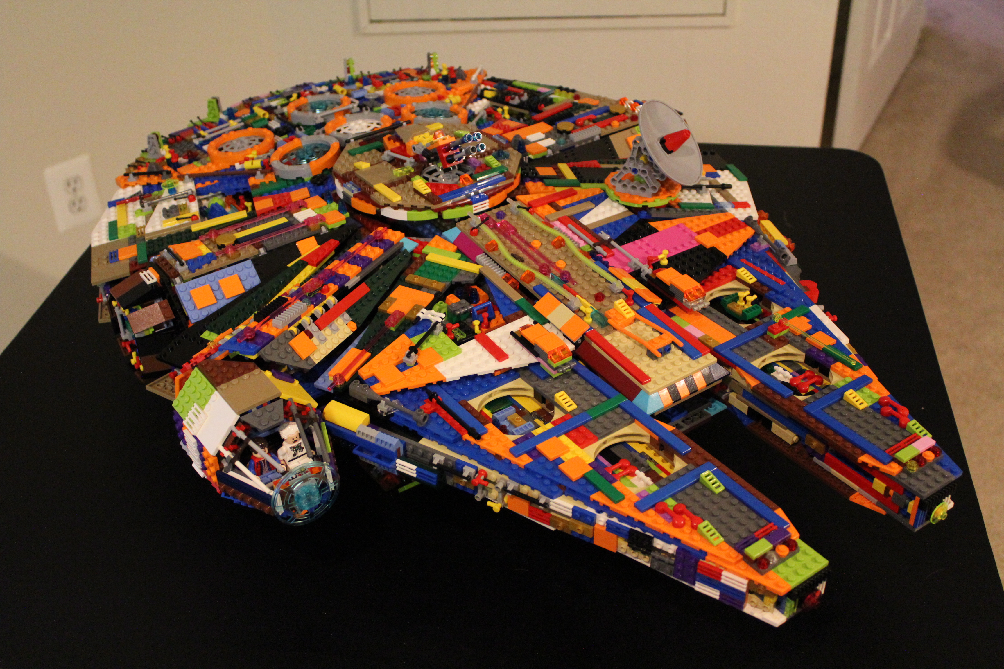 A lego spaceship (star wars millennium falcon) built with a very creative selection of pieces and colours.